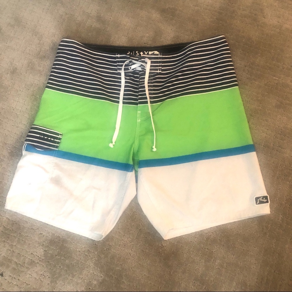 White, black, green board shorts